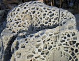 Perforated rock
