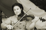 A Fair Young Lady Entertains The Troops With Some Gospel Music On  Her Violin