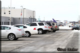 Cars Lineup in Airports Observation Area When Snowy Owls Are Posted On The Web