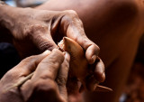 The careful placement of shark's teeth into a carving. IMG_9327.jpg