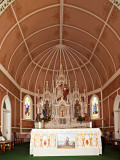 A closeup of the altar and painted ceiling