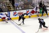 Jeff Carter preventing Benn Ferriero from passing the puck to Logan Couture