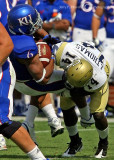 Yellow Jackets DB Jemea Thomas upends Jayhawks RB Rell Lewis for no gain