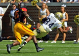 Georgia Tech WR Tyler Melton dives for extra yardage as hes tackled