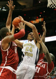 Jackets G Holsey goes up between Crimson Tide F Jacobs and G Rodney Cooper