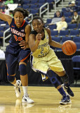 Jackets G Mo Bennett drives the baseline past Cavaliers F McCall