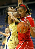 Georgia Tech F Chelsea Regins fights for a loose ball with NC State F Daniel