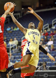 Georgia Tech G Walthour puts up a driving shot under duress