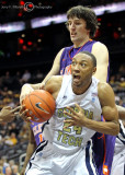 Jackets F Kammeon Holsey secures an offensive rebound