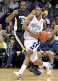 Yellow Jackets G Morris drives hard along the baseline