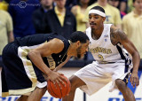 Yellow Jackets G Pierre Jordan squares up on defense against Demon Deacons G CJ Harris