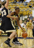 Yellow Jackets F Mitchell tries a baseline move around Demon Deacons F Groves