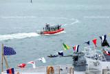 The newly commissioned USCGC BERNARD C. WEBBER (WPC 1101) and a 25-Foot Defender Class Boat CG-25505 patrolling nearby