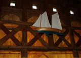 Hanging inside is a replica of a Mackinaw schooner