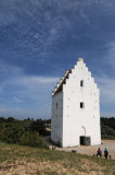 Almost 20 of the steeple is buried under sand