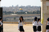 Girls at Palm Sunday procession, with Dome of the Rock in the background
