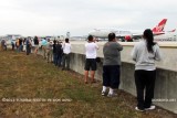 2012 MIA Airfield Tour - tour group photographing Virgin Atlantic B747-4Q8 G-VHOT landing on runway 30