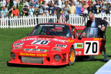 1979 Porsche 935, Fica Frio Collection, Jersey, Channel Is. Racer Hurley Haywood gives Porsche Trophy to Bobby Rahal. (8289)