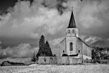 Haltinne church during a snowy day