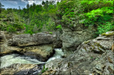 Water rushes into a narrow canyon before it plunges 45 feet over the lower Linville falls