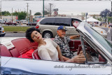 Old man with his doll in his T-Bird