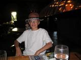 hat on at the dinner table