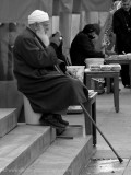 Resting on the steps of the New Mosque