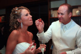FEEDING A STRAWBERRY TO THE BRIDE