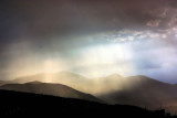 AS THE SUN POKES THROUGH AFTER A RAIN SHOWER