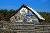 SHAPES ON A OLD STORAGE BUILDING AND PATTERNS IN THE FENCE