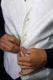 BUTTONING THE VEST