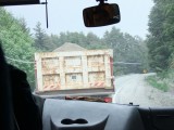 A truck hauling away ash