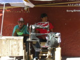A very old Singer footpowered sewing machine. Still in service on the streets of Granda, Nicaragua. Nacatamales on the left.
