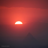 Half Sun Setting Over the Pyramid of Chefren