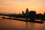 Barge carrying coal, sunset, Cincinnati, Ohio