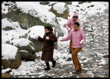 Happy girls with newly fallen snow