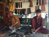 Pathans mending shoes in Samahni