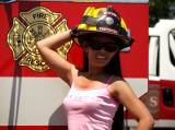 ...And A Friendly Fireman Let Her Wear His Helmet.