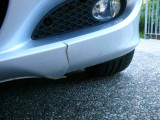 tear in air dam under front bumper (theres a similar tear on the other side)