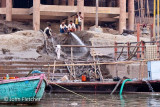 Removing Monsoon Silt Deposits from the Ghats.