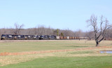 Southbound coal train 792 passes a crewless 167, tied down on #2 track at Bowen 