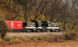 A pair of Southern SW1s work hard up Henry hill in the low morning sun 