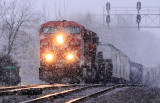 A pair of CP GEs lead NS train 142 through the snow at Gradison 