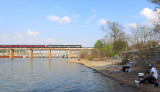 OCS 951 crosses Tenbridge as they enter Chattanooga, as the local fishermen enjoy a warm afternoon on the banks of the TN river 