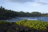 Black sand beach on the southern shore