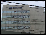 AIG Building with Wheel Reflections