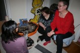 Linda, sa and Lena looking at the kittens in the basket