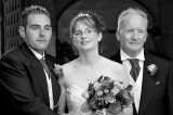 The Bride and Groom with the Brides Dad in Black and White