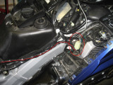 The interface cable gets plugged into the CB connector under the top shelter and harness routed down right side of frame
