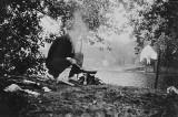 Ashley cooking eggs and bacon at Whitchurch Lock Island, 1901